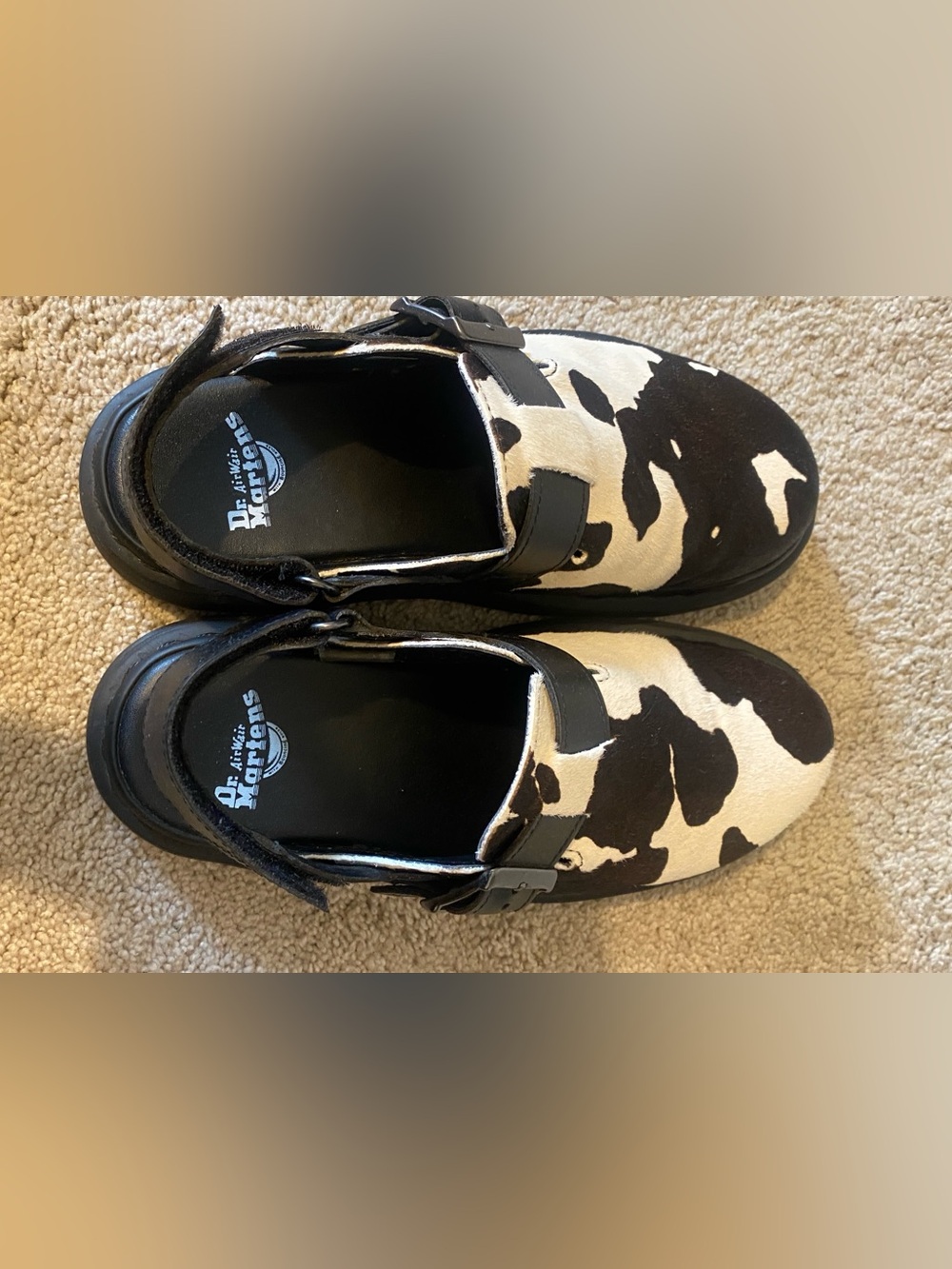 Dr. Martens Black & White Cow Print Leather Clogs with Buckle
